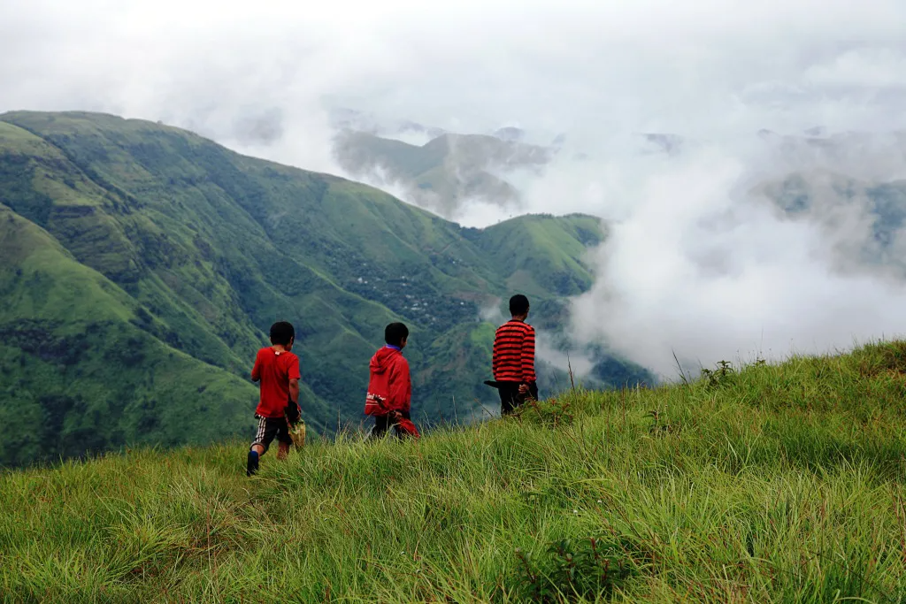 3 men walking across the Garo Hills